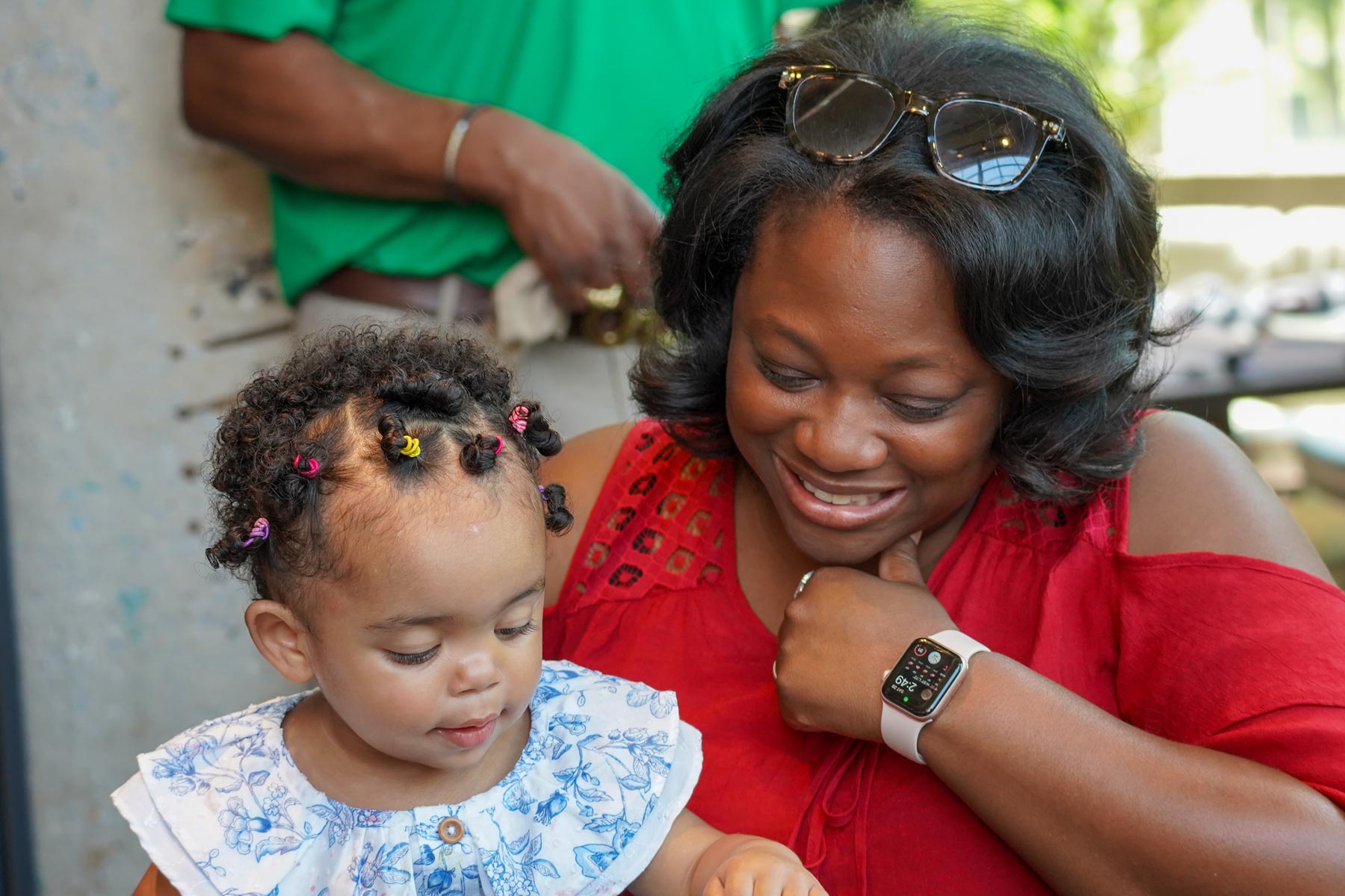 A Candid Close-Up Of A Mother And Her Young Daughter